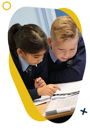 Two young students working together and studying their work books. 